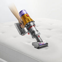 Dyson V12 Detect Slim Absolute cordless stick vacuum cleaner in sleek design, showcasing its lightweight build and features.