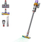 Dyson V15 Detect™ Absolute stick vacuum with laser technology and 240 AW suction power in action on a hardwood floor.