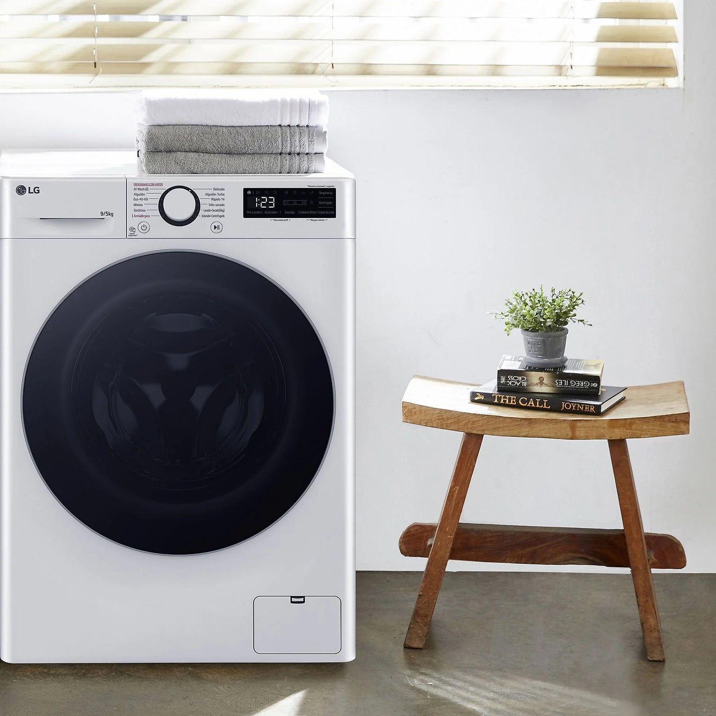 LG F2DR5S09A1W washer dryer, 9 kg wash capacity, 5 kg dry capacity, white color, 1200 rpm, 12 programs displayed.