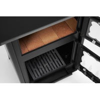 Estufa de leña Etna con horno superior y puertas de cristal vitrocerámico, ideal para calentar y cocinar.